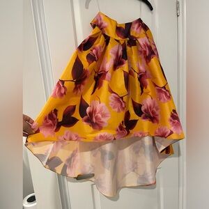 Never worn high waisted floral skirt. Size S. Tie bow front or back. Classy.